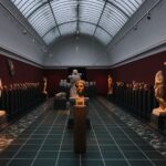 Denver Art Museum gallery displaying classical sculptures and busts in a spacious exhibition hall