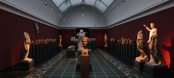Denver Art Museum gallery displaying classical sculptures and busts in a spacious exhibition hall
